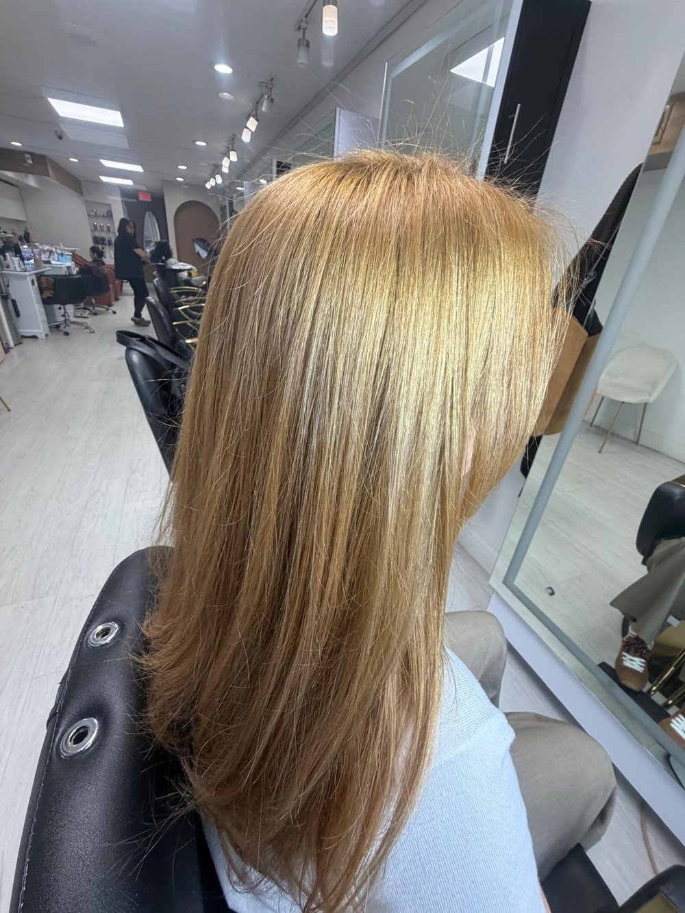 Auburn waves with subtle highlights at Lush Atelier