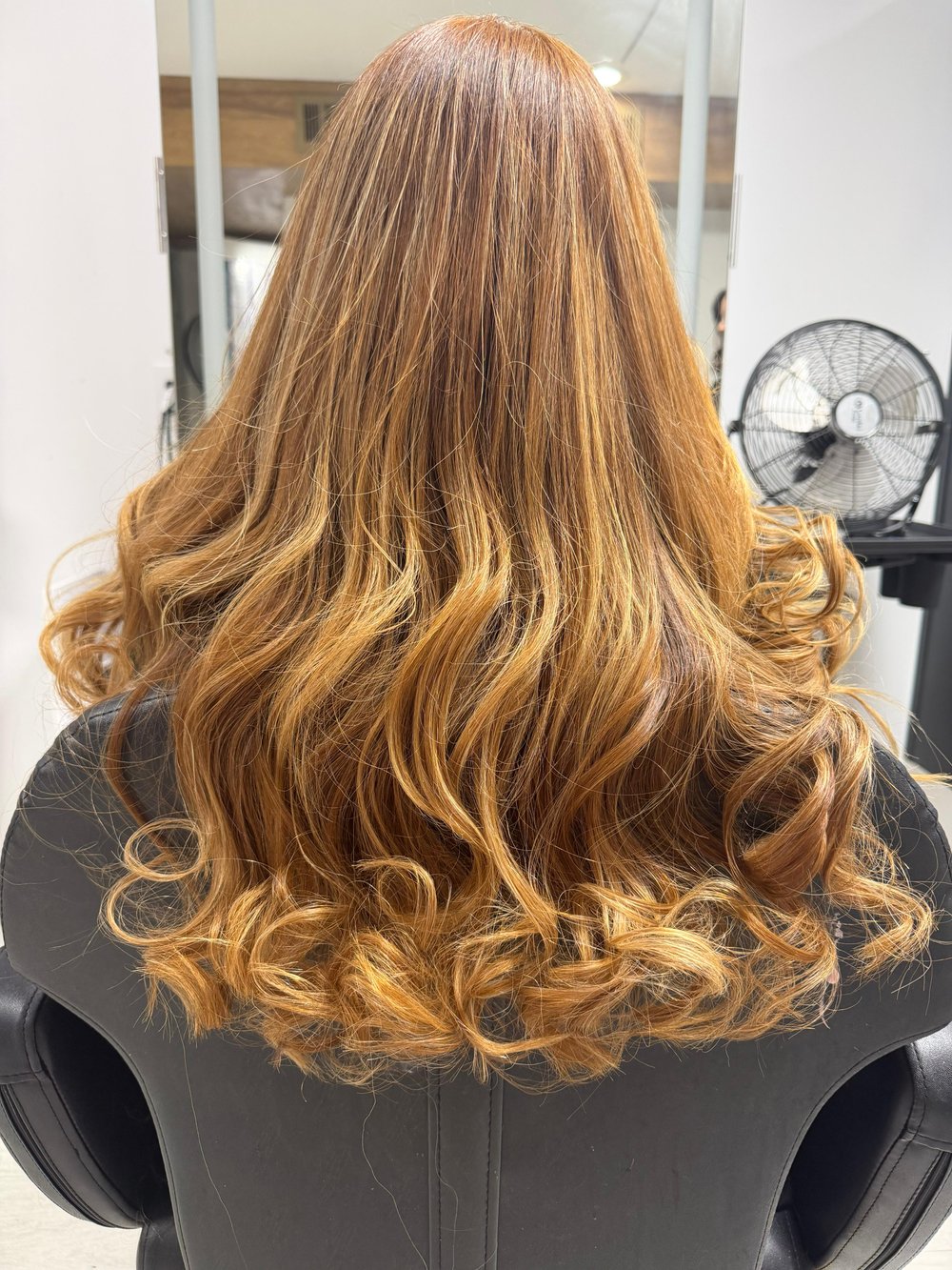 Auburn waves with curls at Lush Atelier