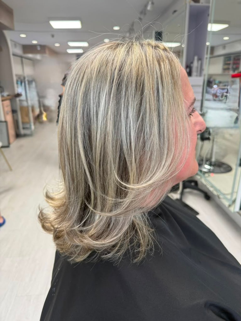 Ash blonde layered blowout — Lush Atelier Beauty Salon